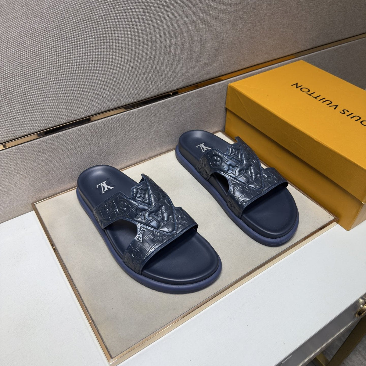 Louis Vuitton Textured Monogram Slide Sandals — hero